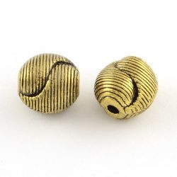   25db. Golyó. 9.5x9.5x8mm. Yin-yang. Antik arany szín. Fémgyöngy, köztes gyöngy.