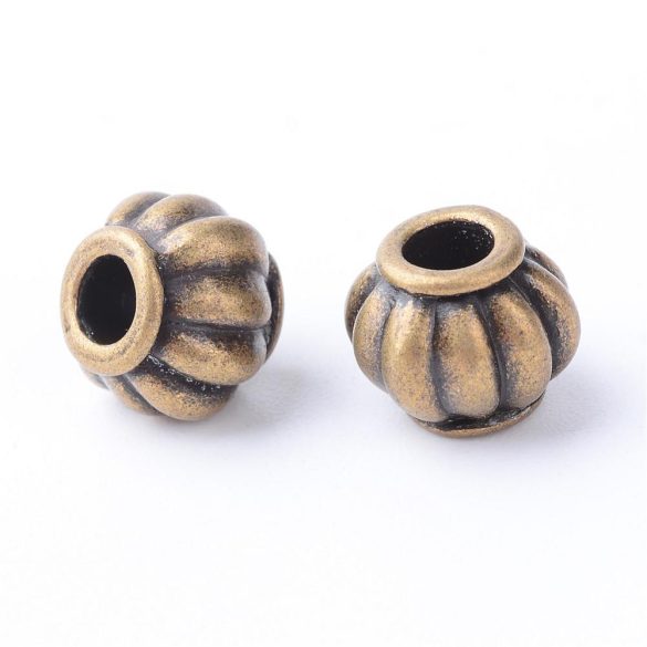 50db. Fém köztes gyöngy. 9x7.5mm. Antik bronz szín.