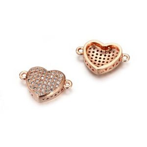 Cirkon szív összekötő elem. Rózsaarany szín, fehér kristály.