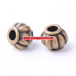 50db. Köztes fémgyöngy. 9x7.5mm. Antik bronz szín. 