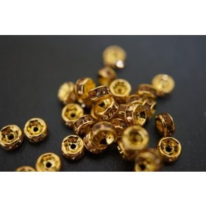 100db. . Strasszos köztes gyöngy, rondella. 6mm. Arany-pezsgő. 